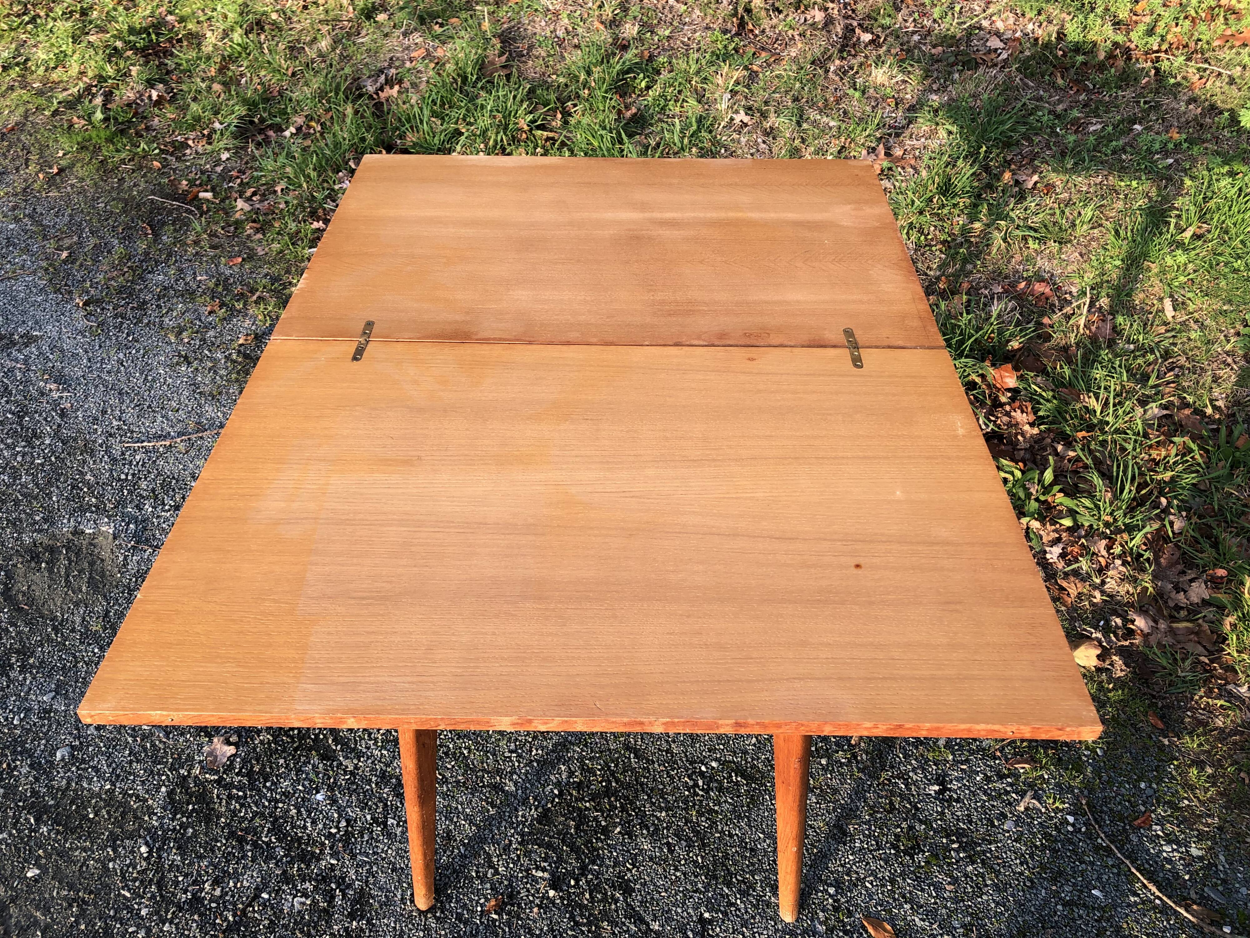 Vintage so-called portfolio table with oak compass base and its oak cp swivel top.