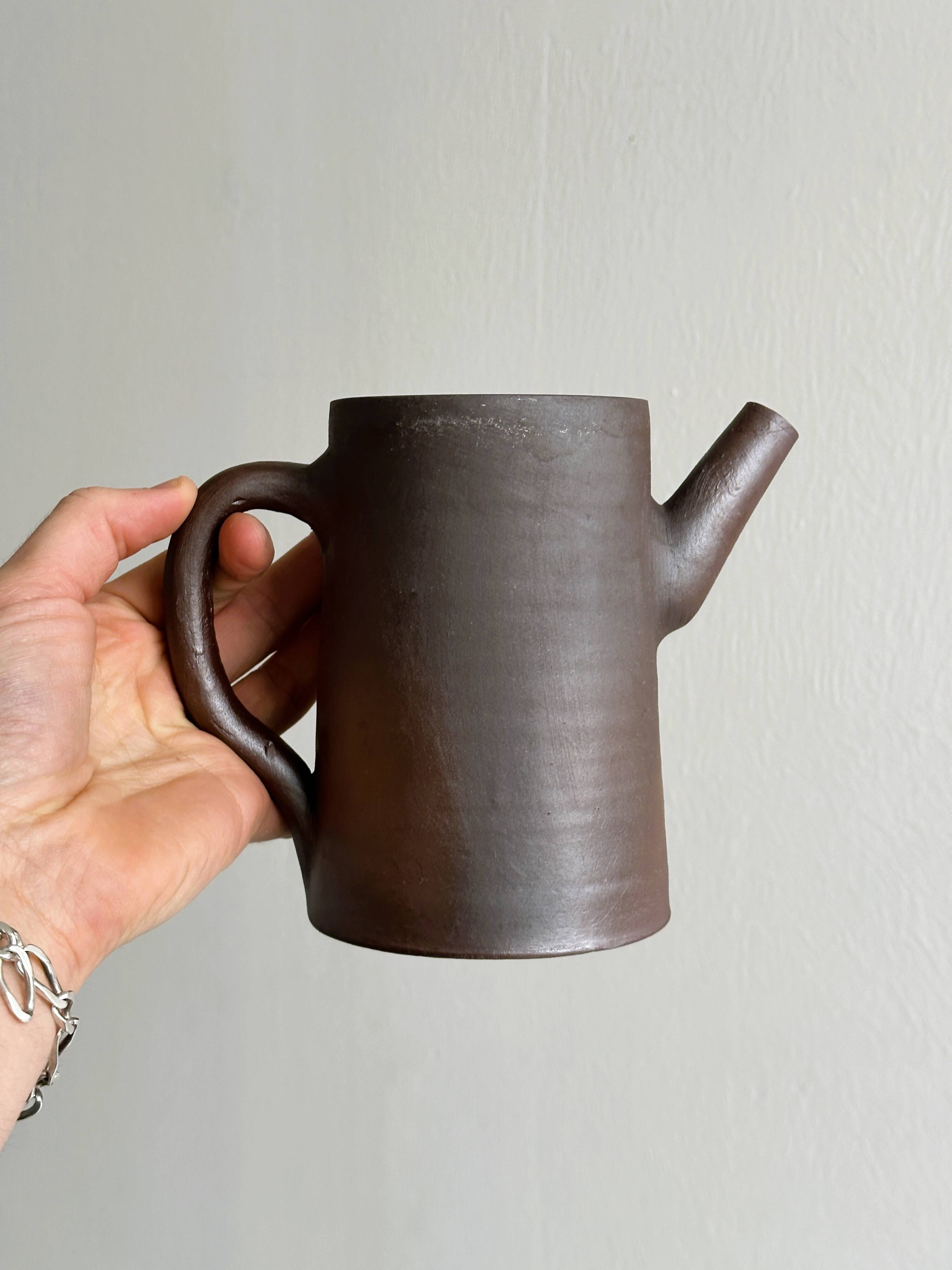Small pitcher in brown glazed stoneware