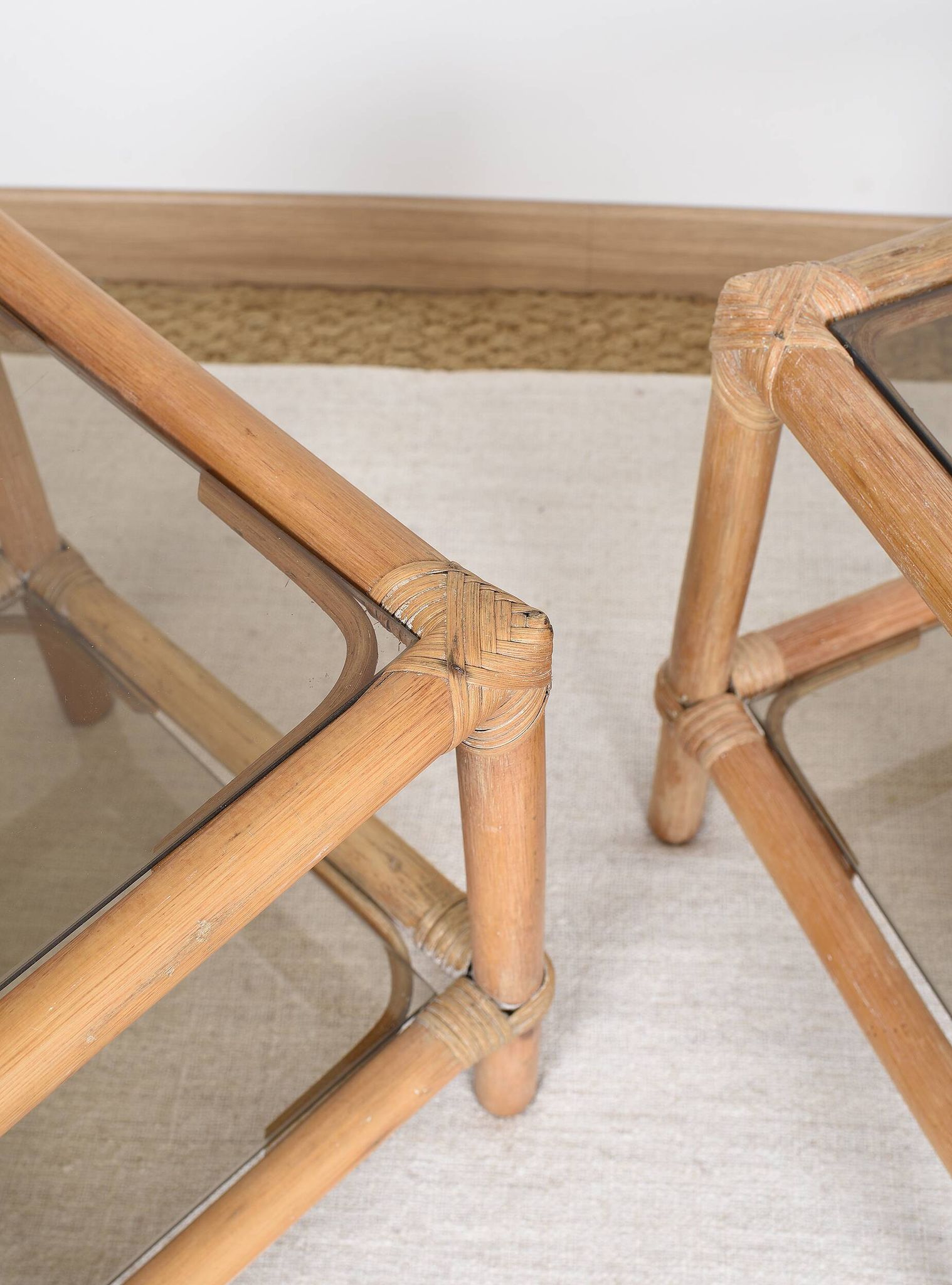 Pair of bedside tables or side tables, in rattan and smoked glass