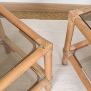 Pair of bedside tables or side tables, in rattan and smoked glass