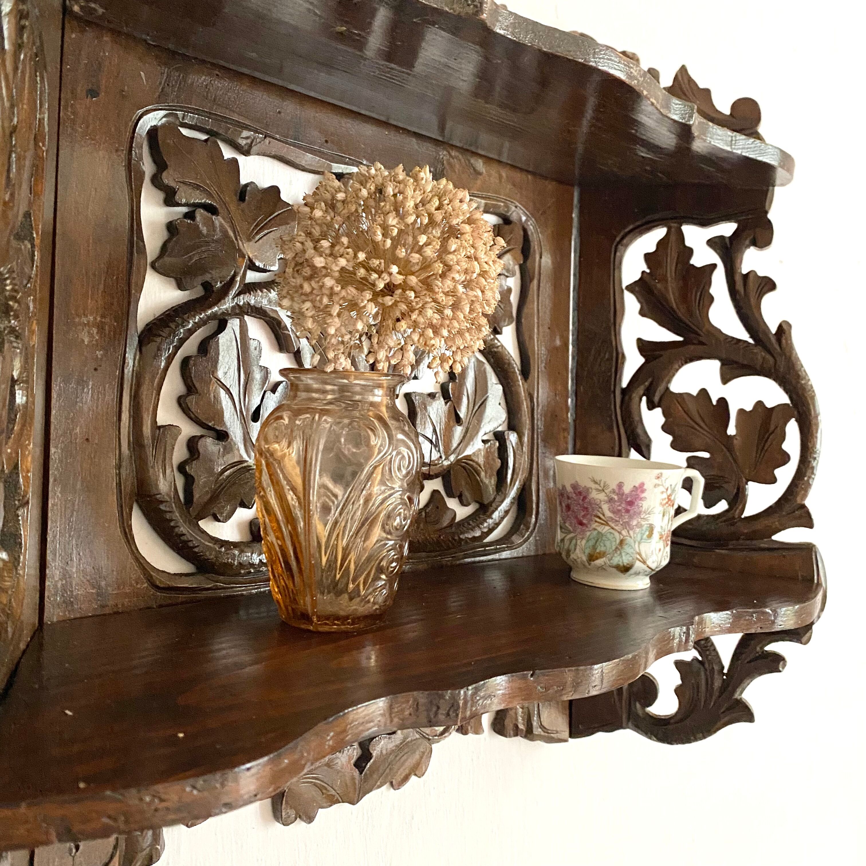 Carved wooden wall shelf