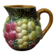 Small jug, milk pot in slipware with relief fruits Salins les Bains