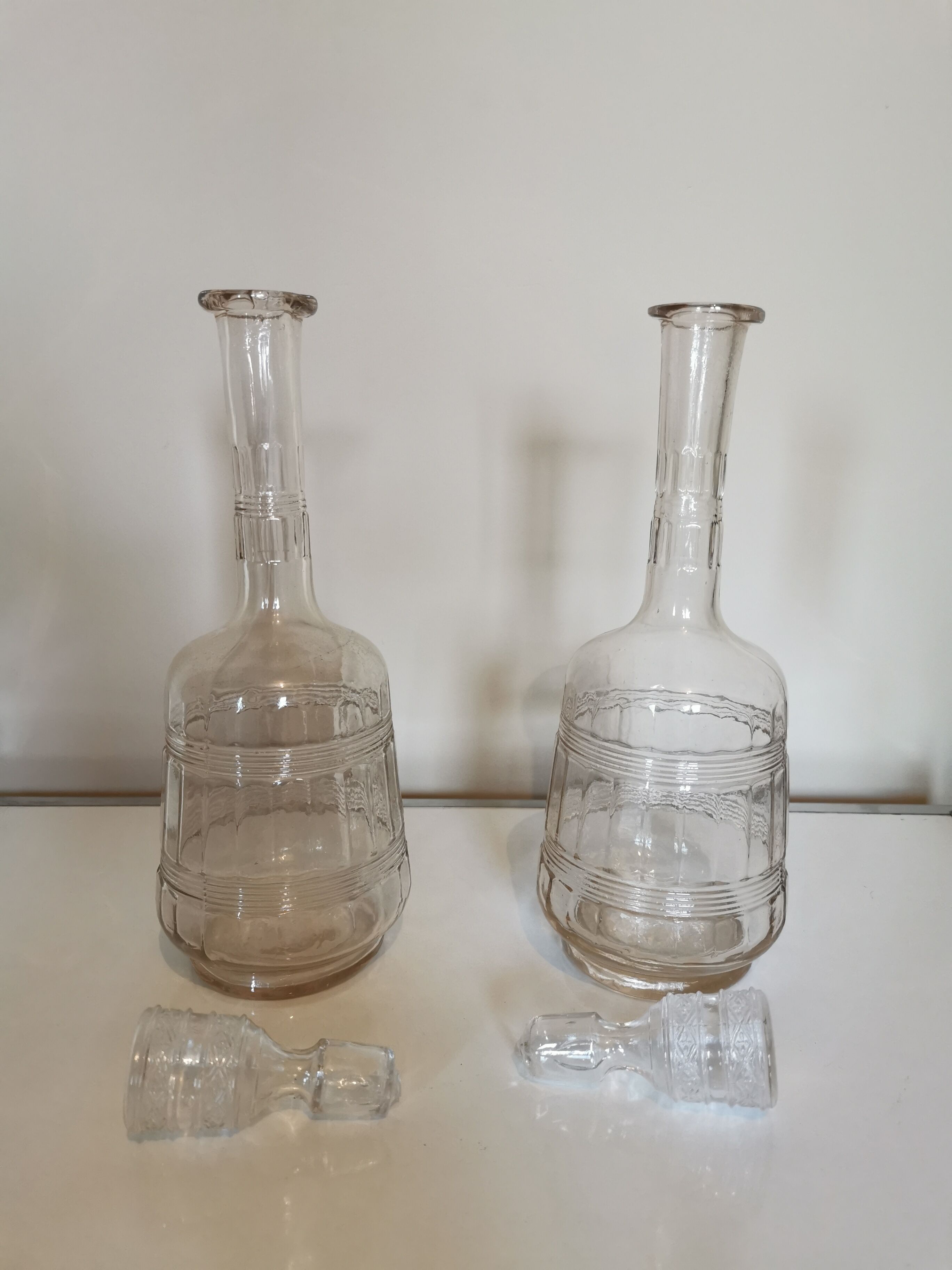 Pair of antique moulded glass decanters
