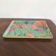 Vintage fiberglass platter with exotic décor and parrots