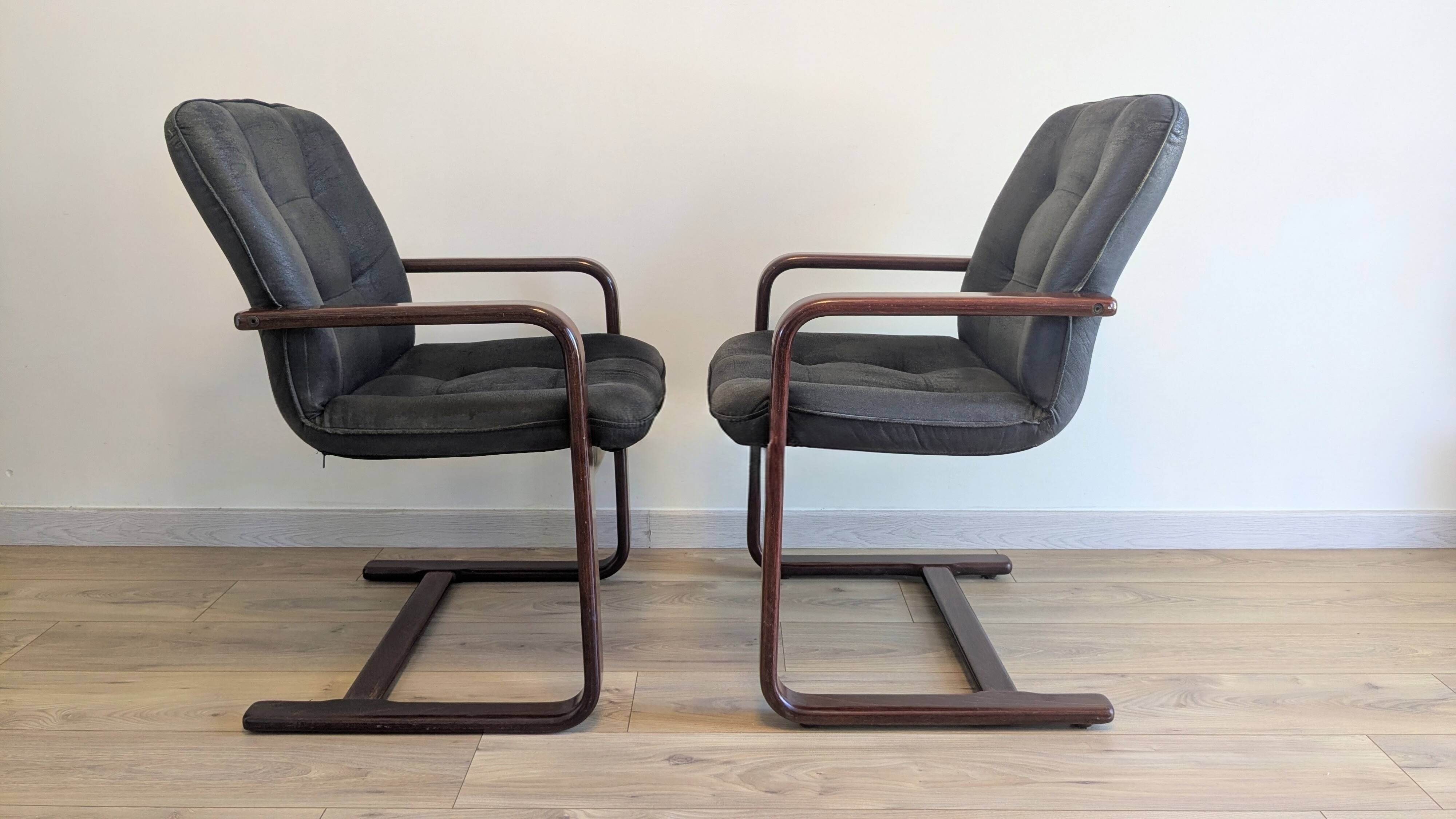 Pair of vintage cantilever armchairs in rosewood veneer.