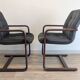 Pair of vintage cantilever armchairs in rosewood veneer.