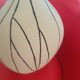 Designer vase in white ceramic with enamelled black stripes.