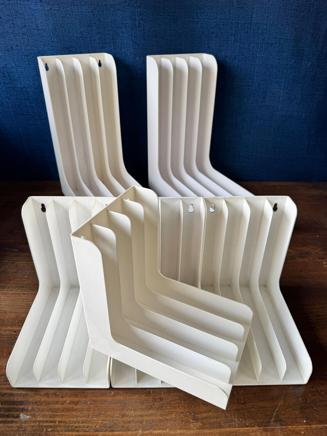 Set of 6 boomerang-shaped vinyl record racks/storage units. 1970s/80s.