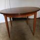 Round rosewood table with extension from the 70s