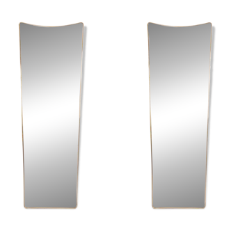 Pair of narrow gilt brass mirrors. Circa 1970.