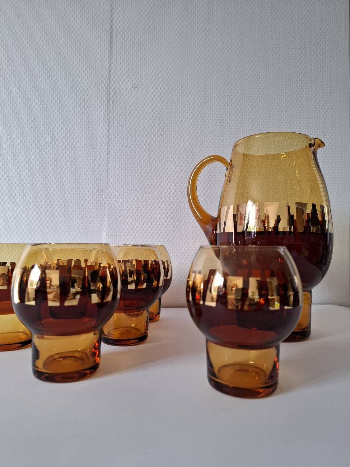 Carafe and its amber/golden glasses from the 70s.