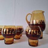 Carafe and its amber/gold glasses from the 70s