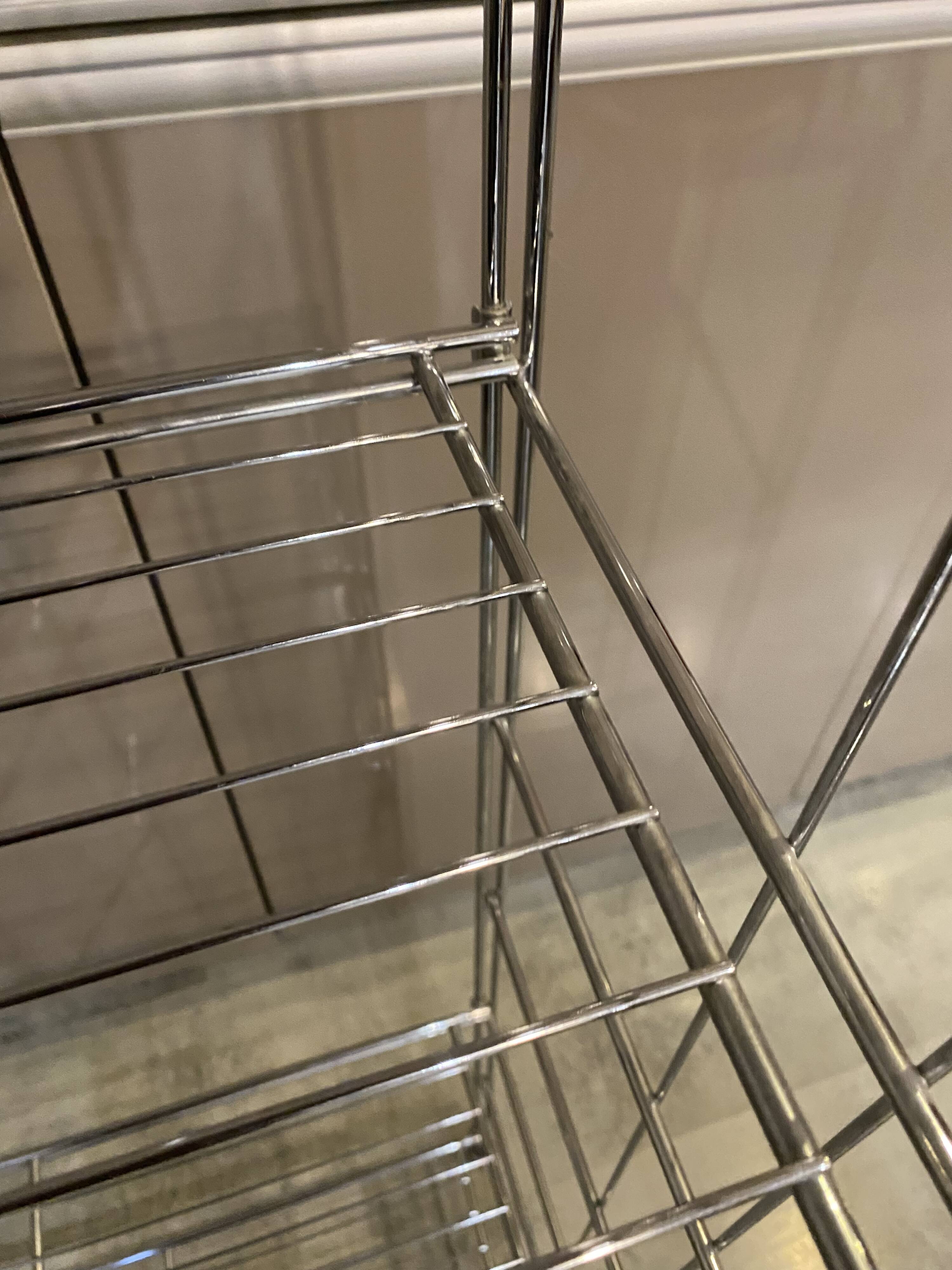 Modular wall bookshelf desk in vintage chrome.