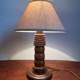 Table lamp with carved wooden base