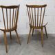 Pair of Baumann Menuet chairs, Honey patina, White skai seat