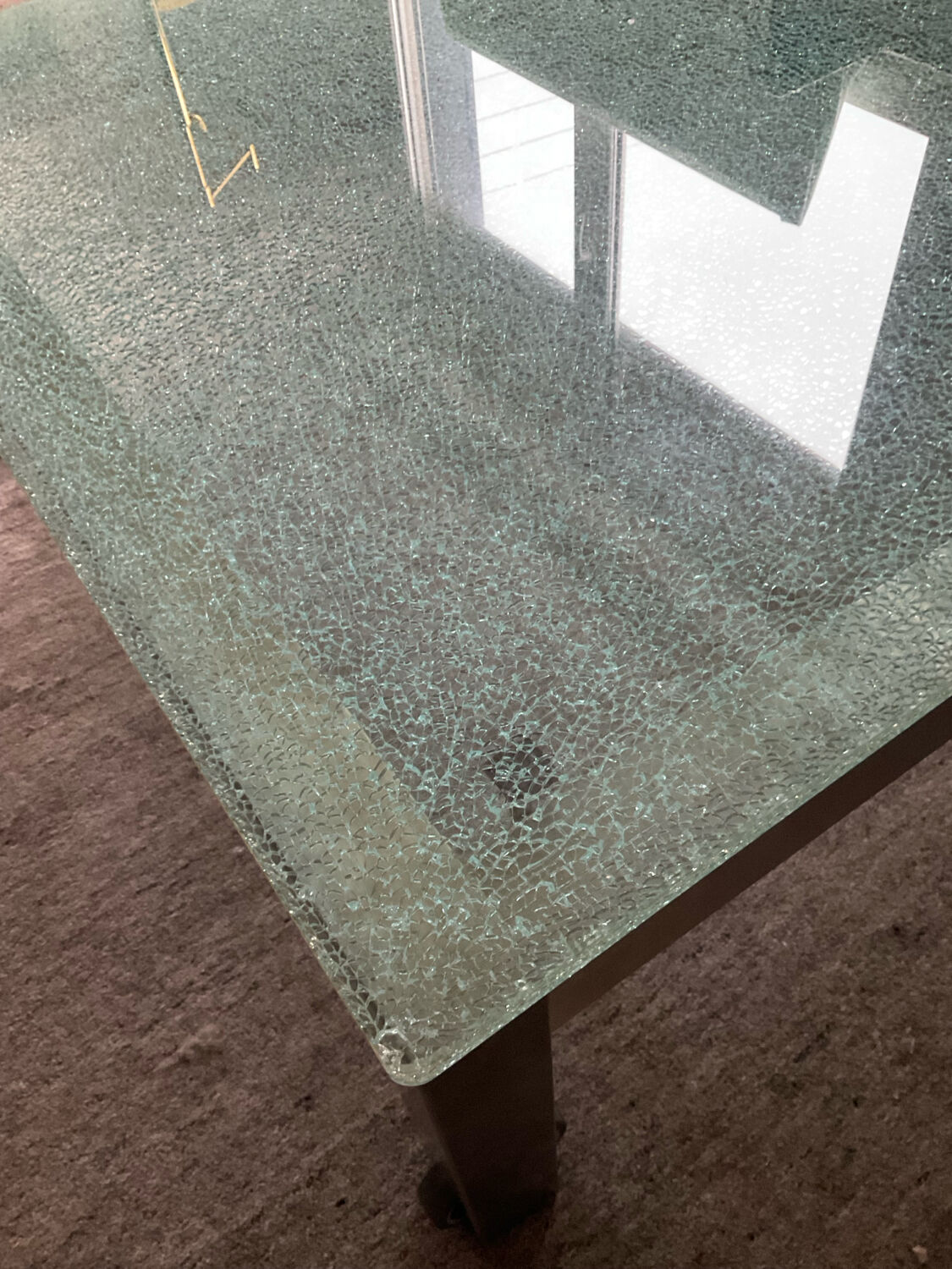 Designer garden coffee table in tempered glass and stainless steel