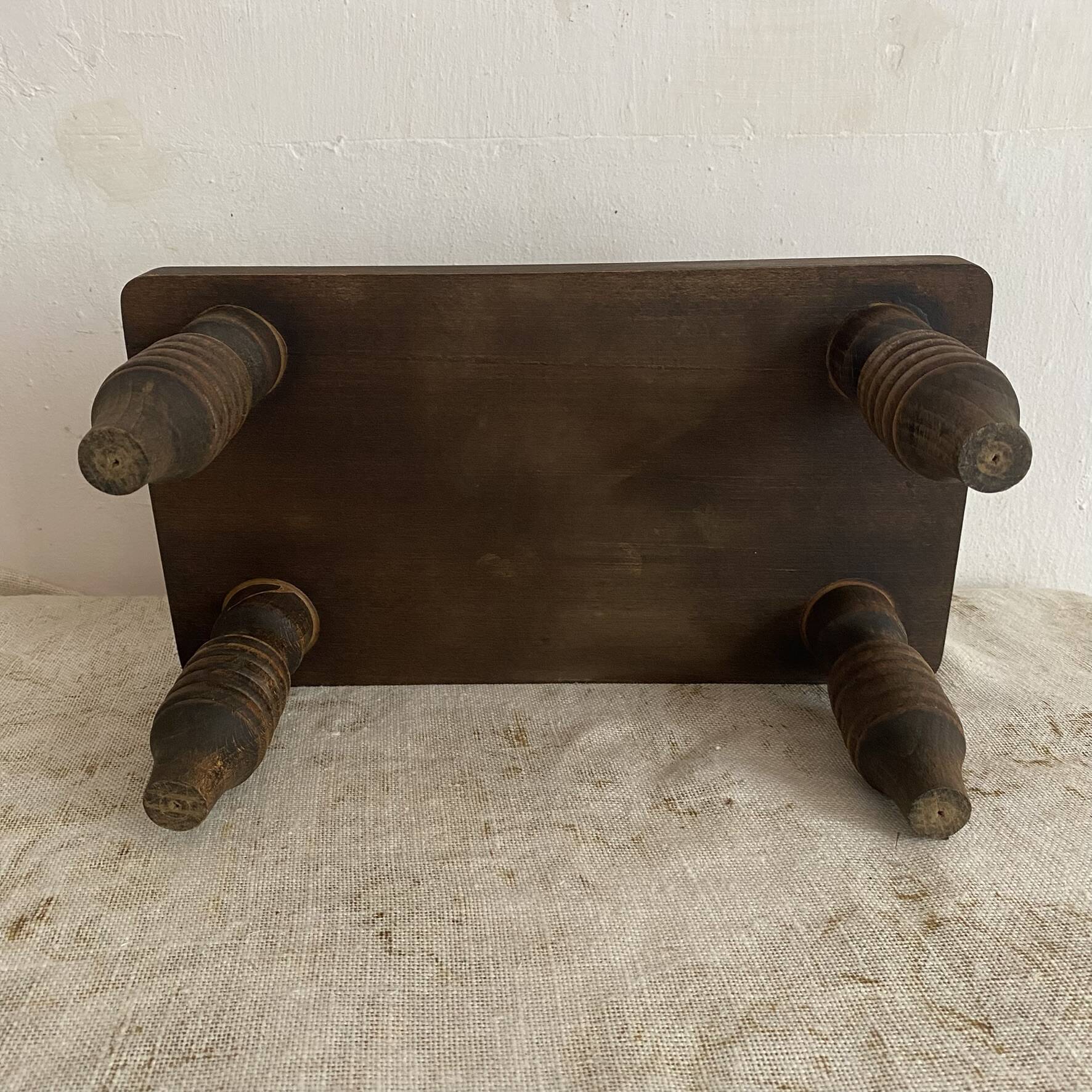 Low stool, turned wooden legs.
