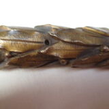 old bronze curved pediment