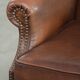Cowhide wingback armchair in English style finished with decorative nails