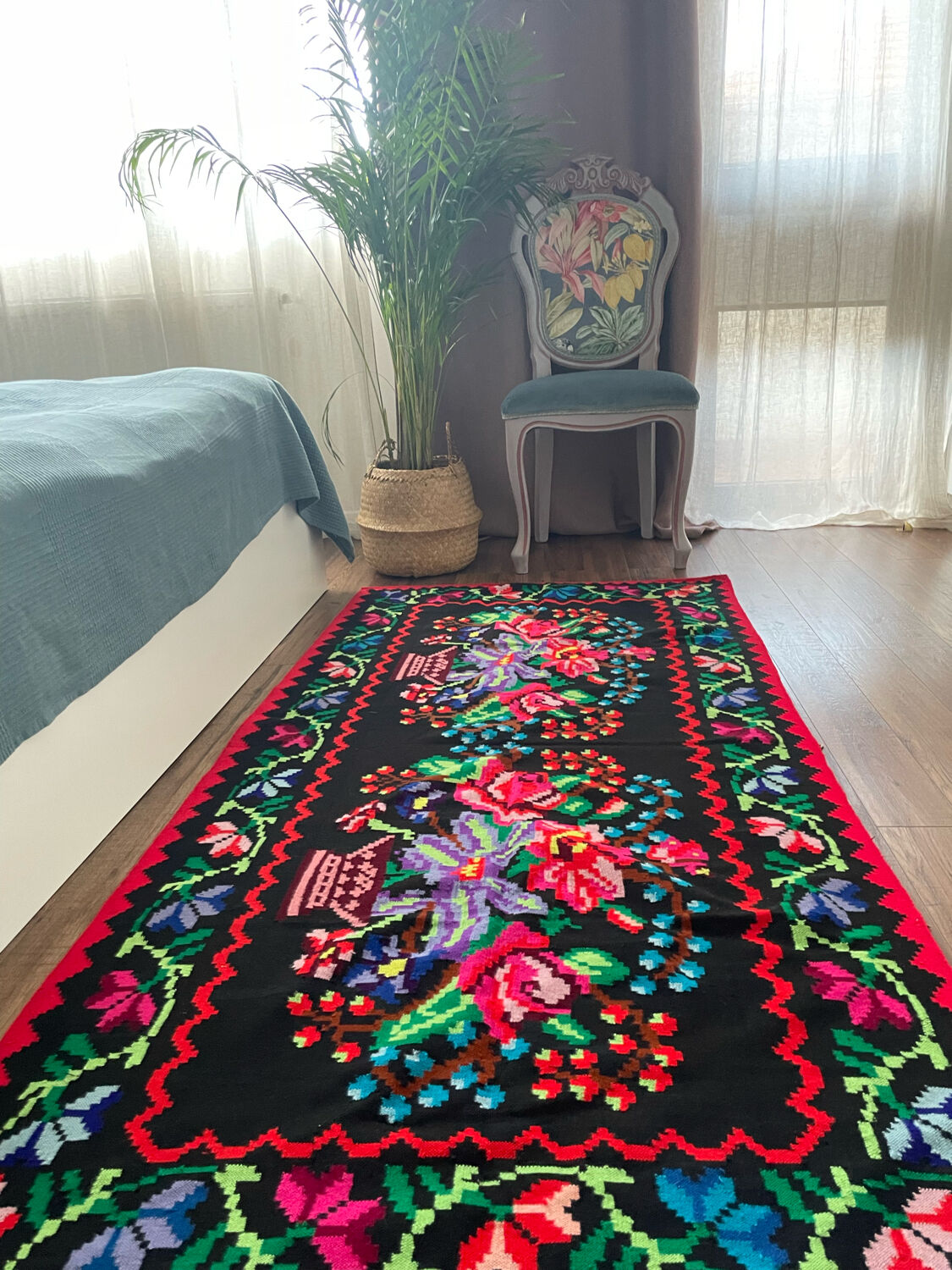 Vintage Romanian handwoven carpet with floral colorful design