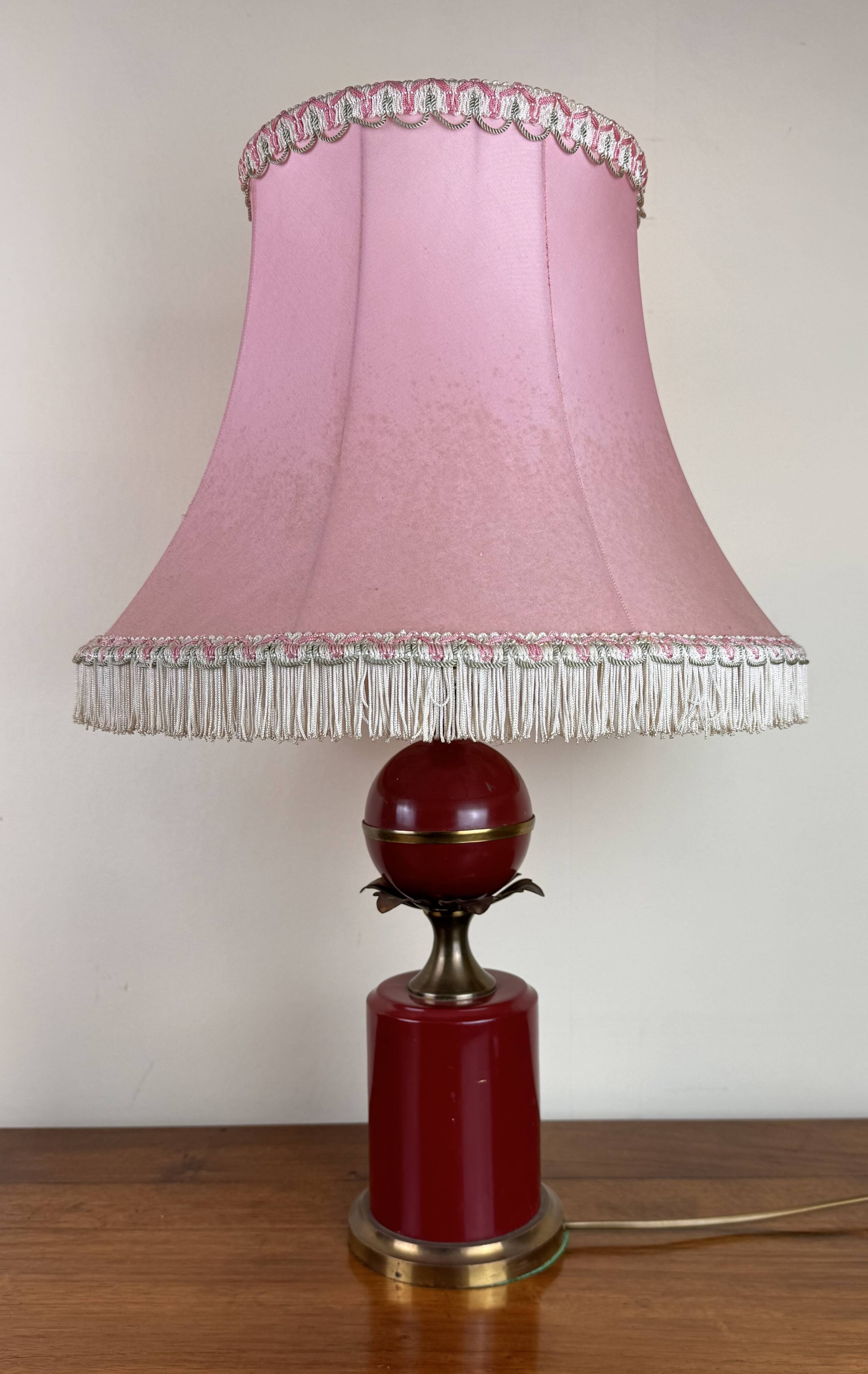 Art deco style desk lamp with a burgundy red sphere in the center the body is in lacquered iron