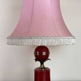 Art deco style desk lamp with a burgundy red sphere in the center the body is in lacquered iron