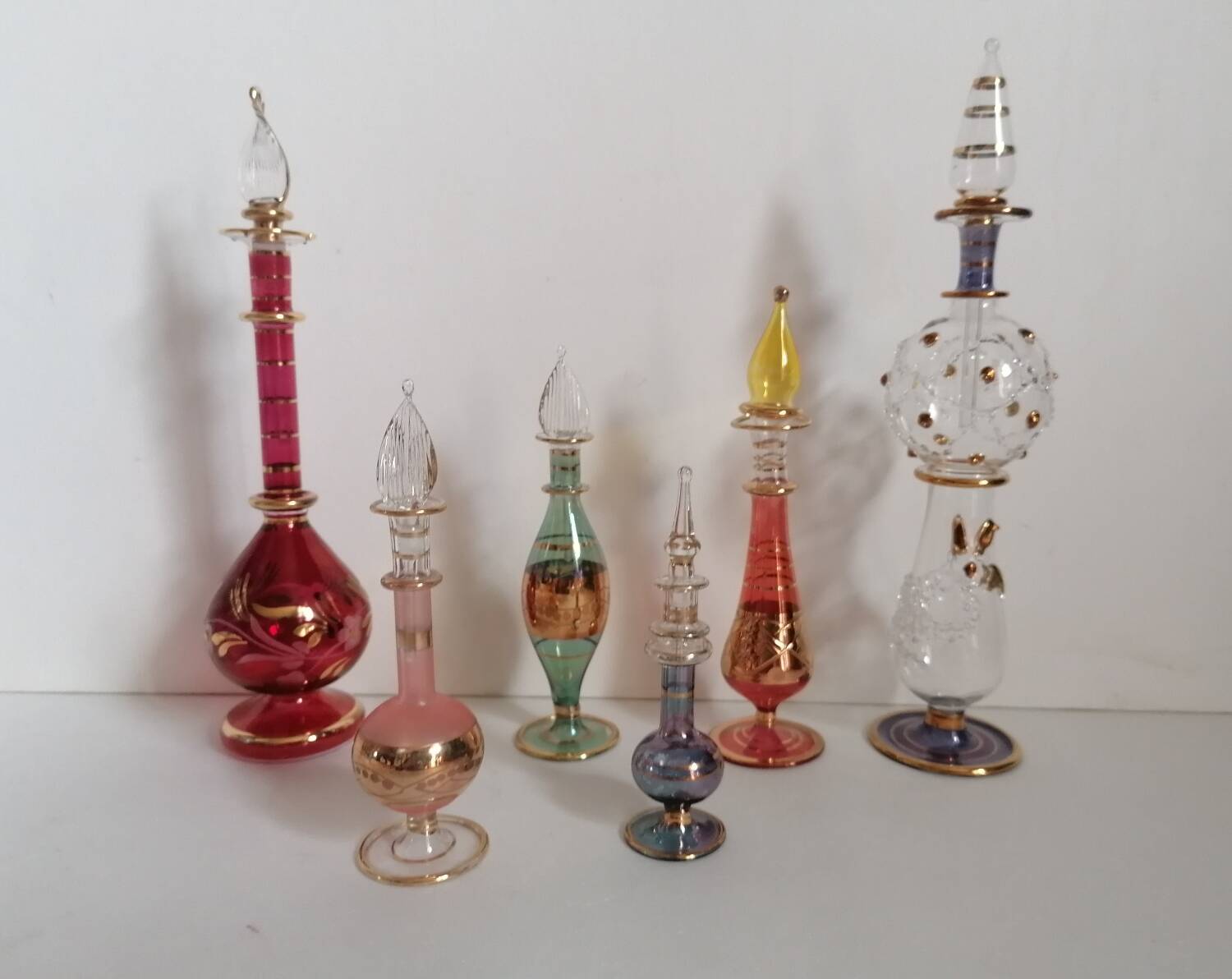 6 Egyptian gold and mouth-blown perfume bottles