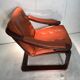 Duo of ochre leather and wood frame armchairs