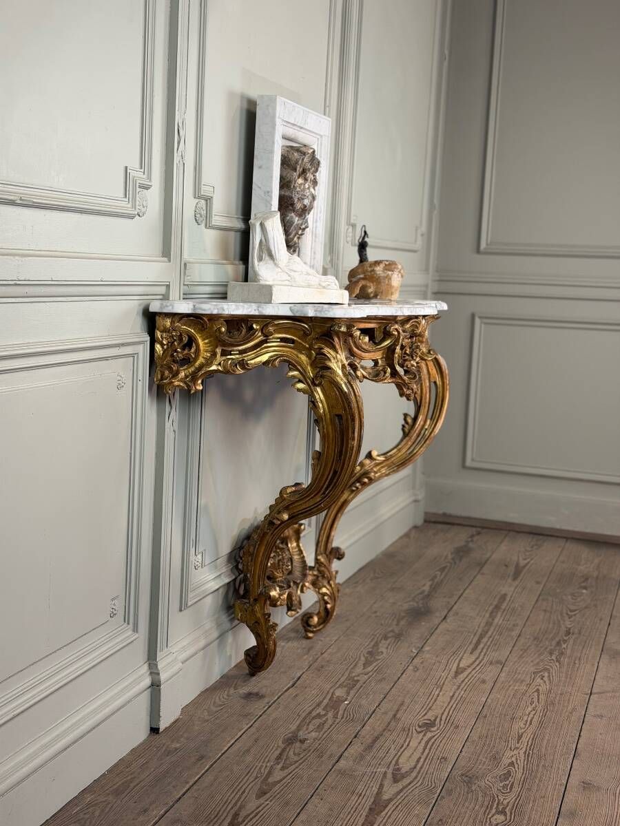Louis XV style console in carved and gilded wood, circa 1880.