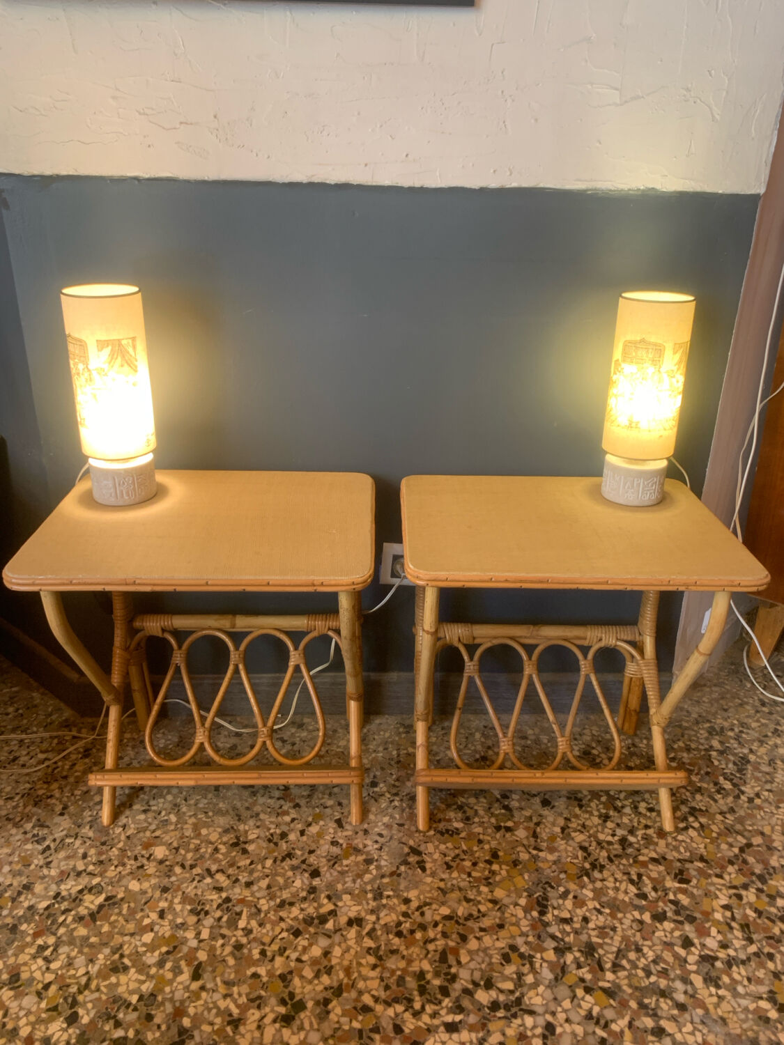 A pair of rattan bedside tables.