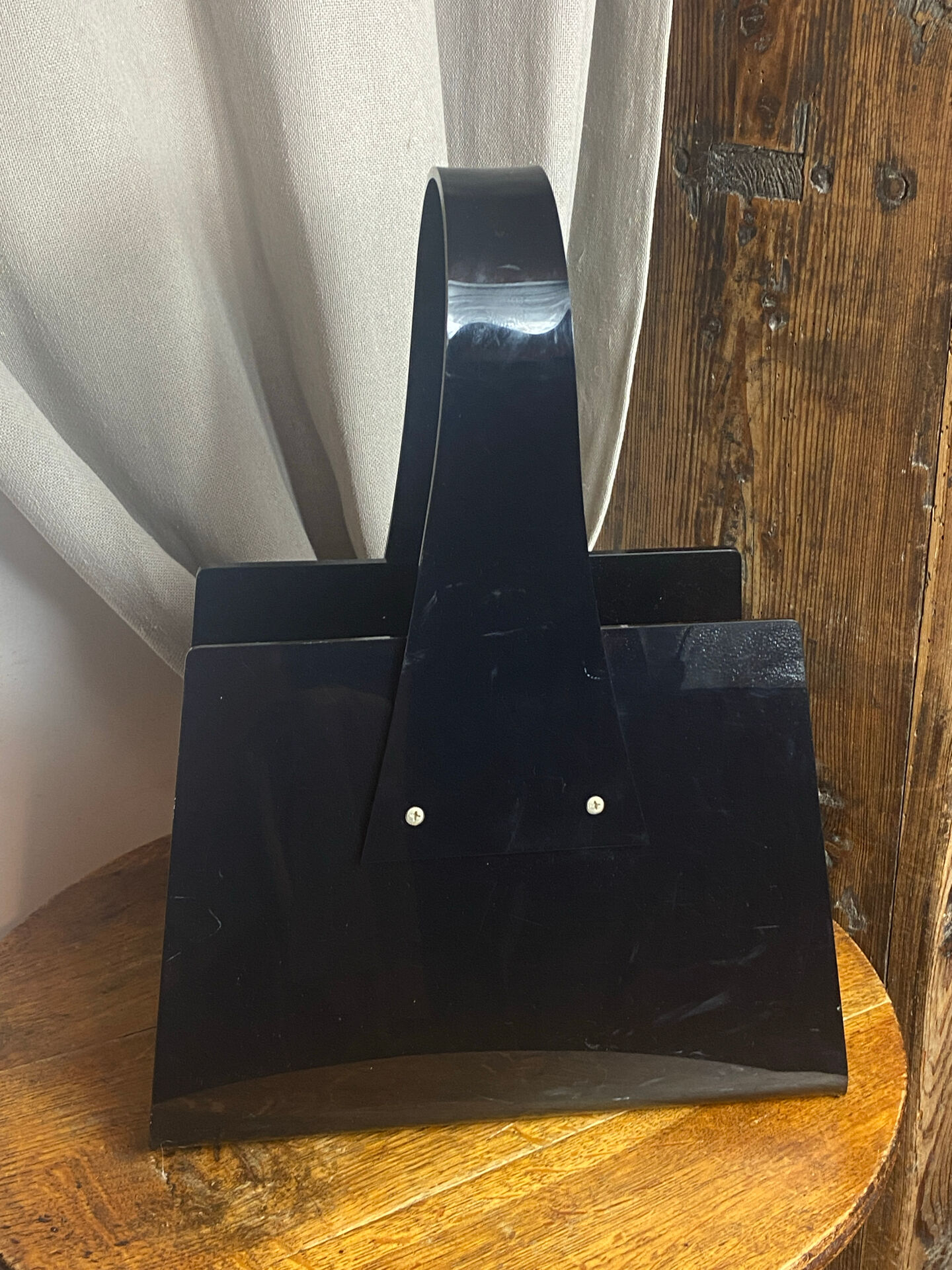 Black plexiglass magazine rack