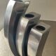 Trio of cast aluminum candle holders