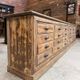 Large workshop furniture transformed into a TV unit.