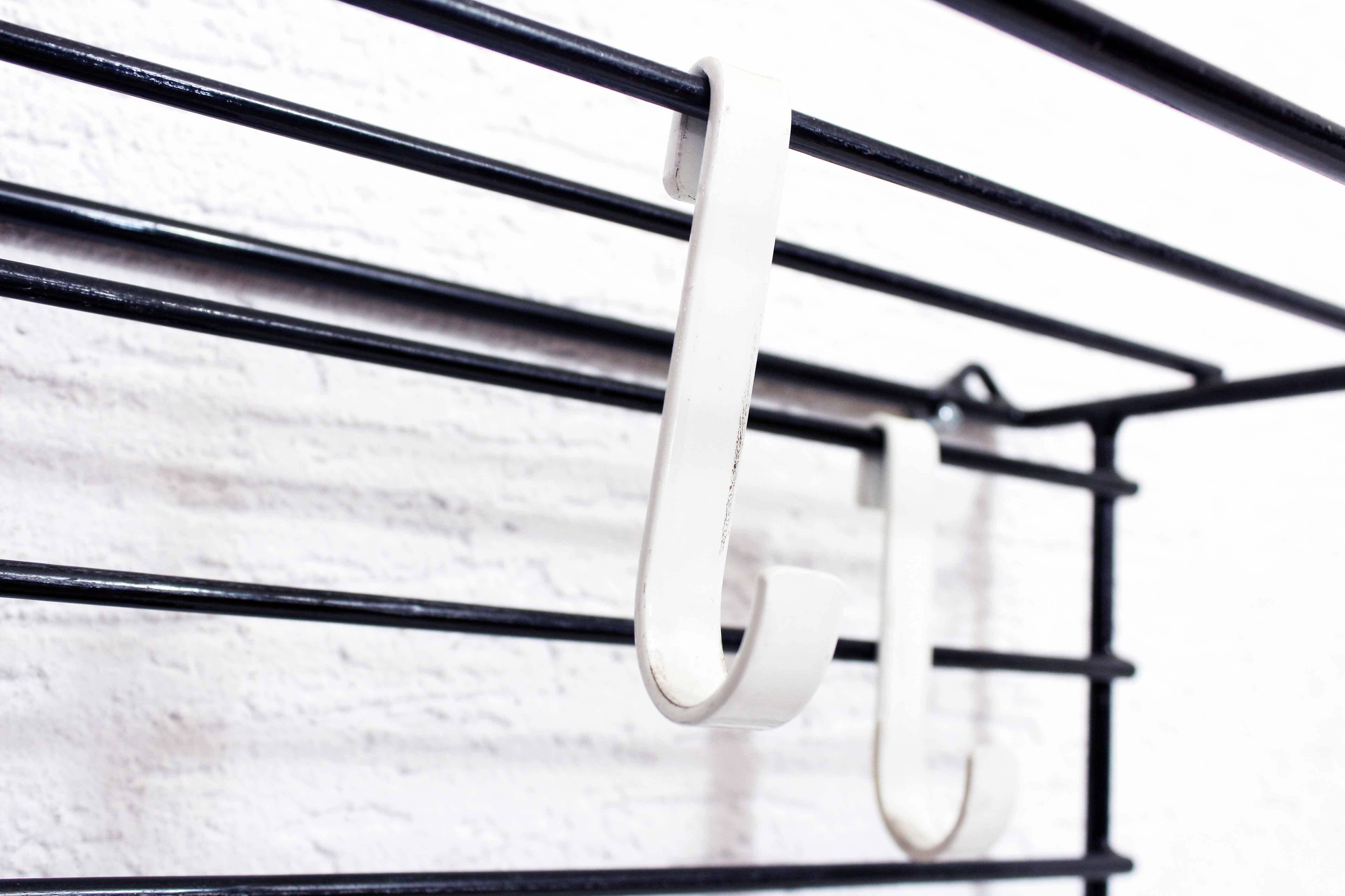 Wall coat rack with removable hooks