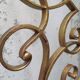 Golden wrought iron bedhead