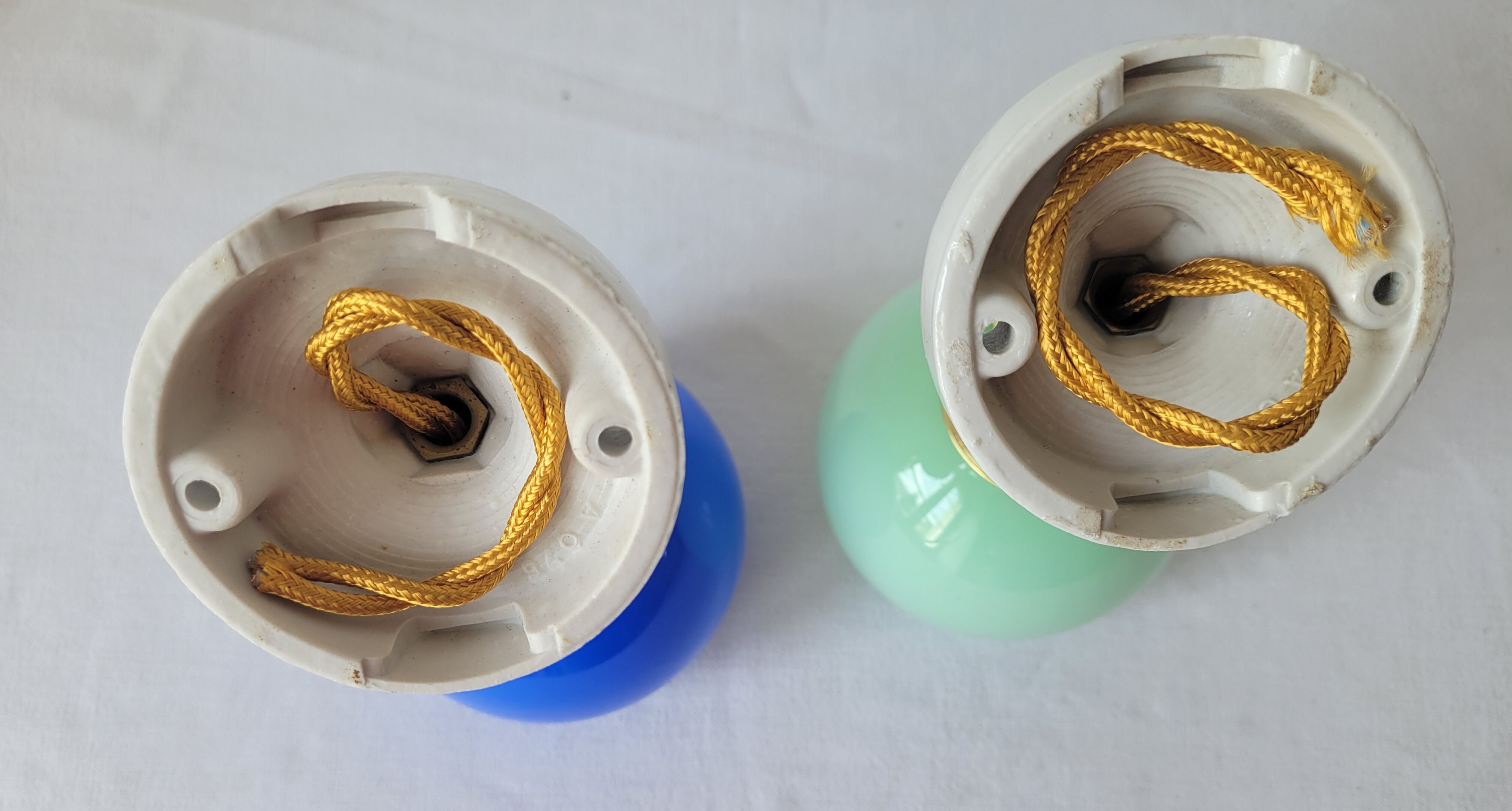 Duo of porcelain and opaline wall lamps