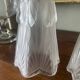 Pair of Art Deco wall sconces in frosted molded glass