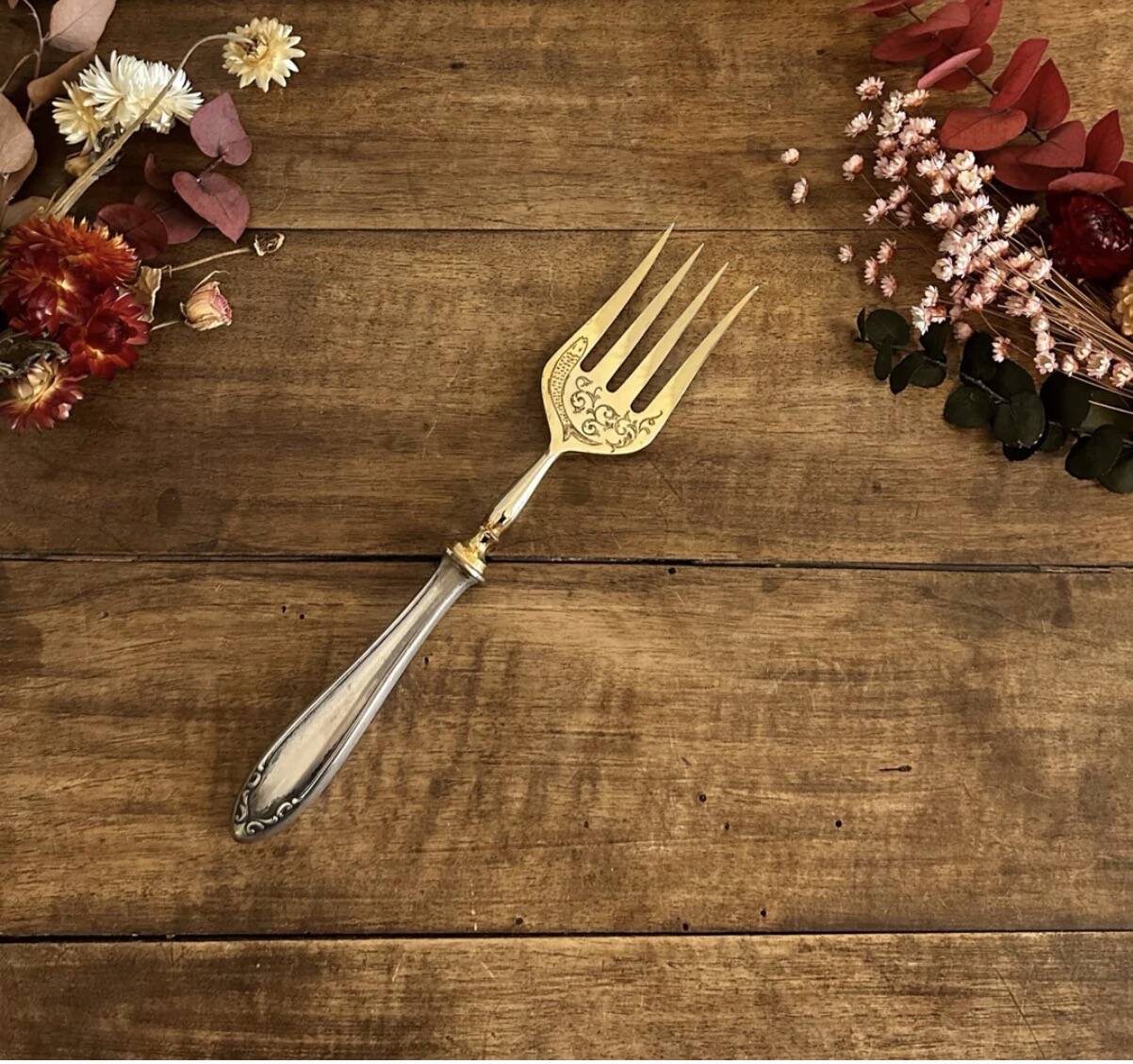 Engraved meat fork in silver and gold metal