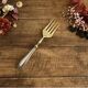 Engraved meat fork in silver and gold metal