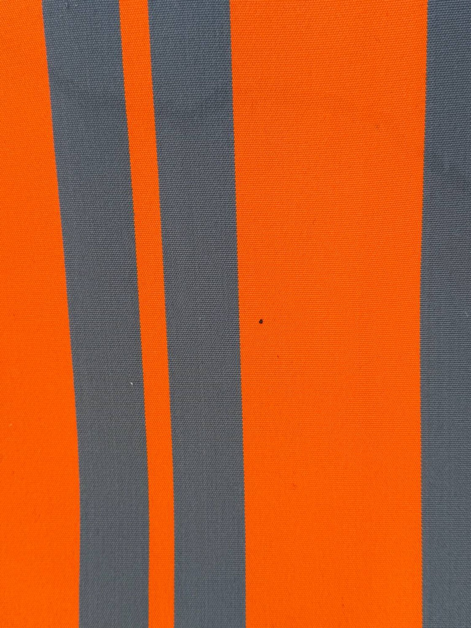 Vintage deck chair with orange and grey striped fabric, original patina.
