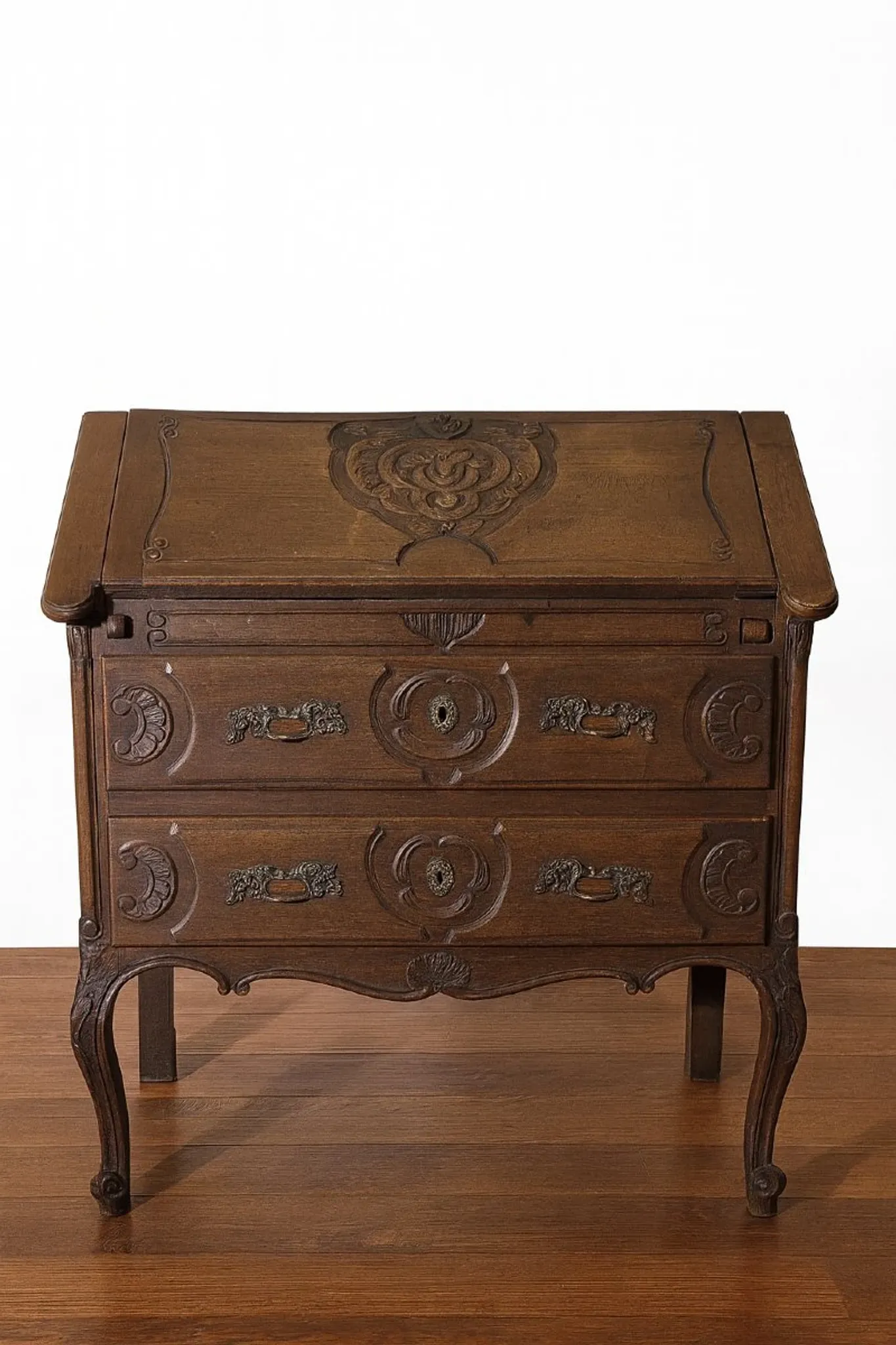 Antique solid wood secretary richly carved, in the Louis XV style.