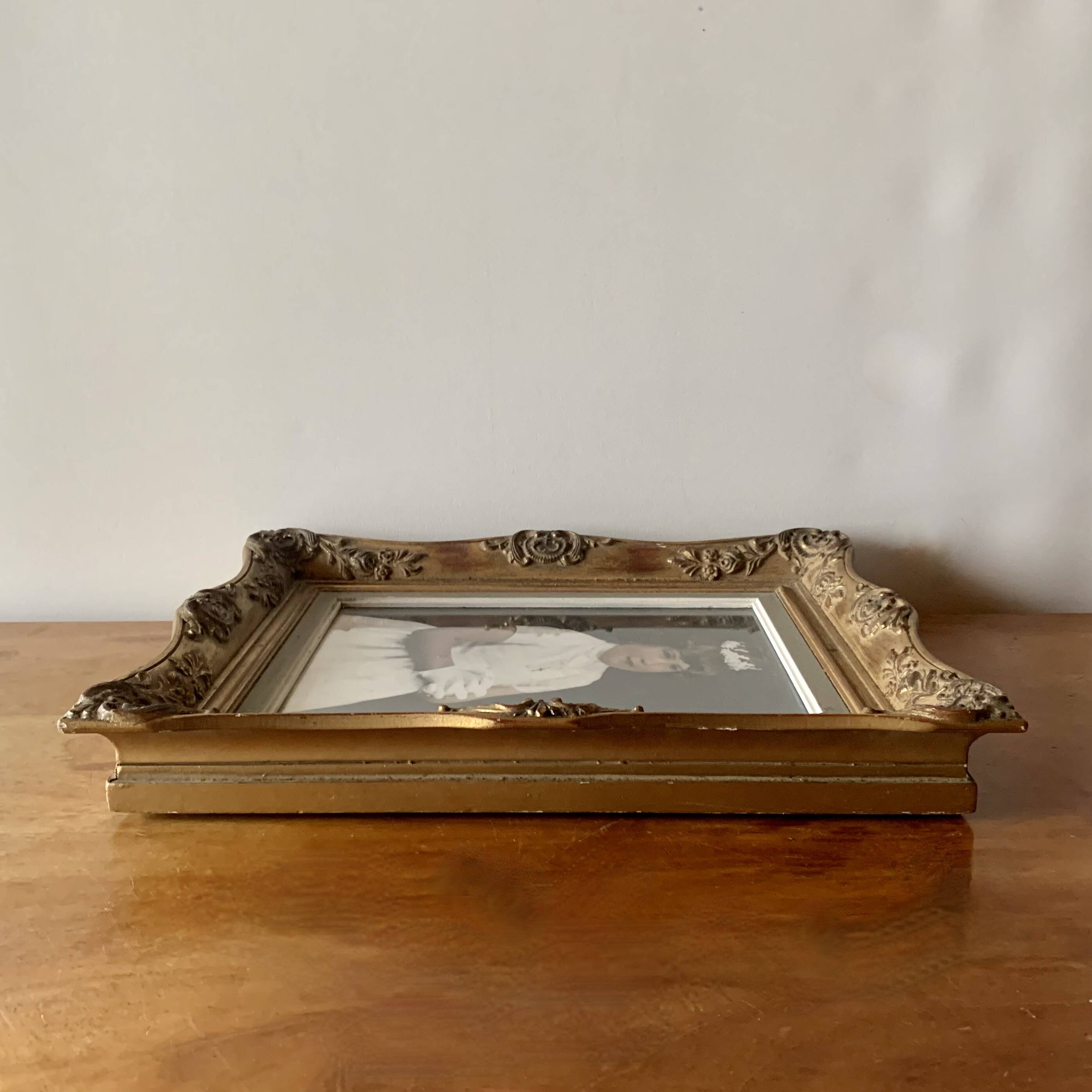 Old gilded carved wooden wall frame