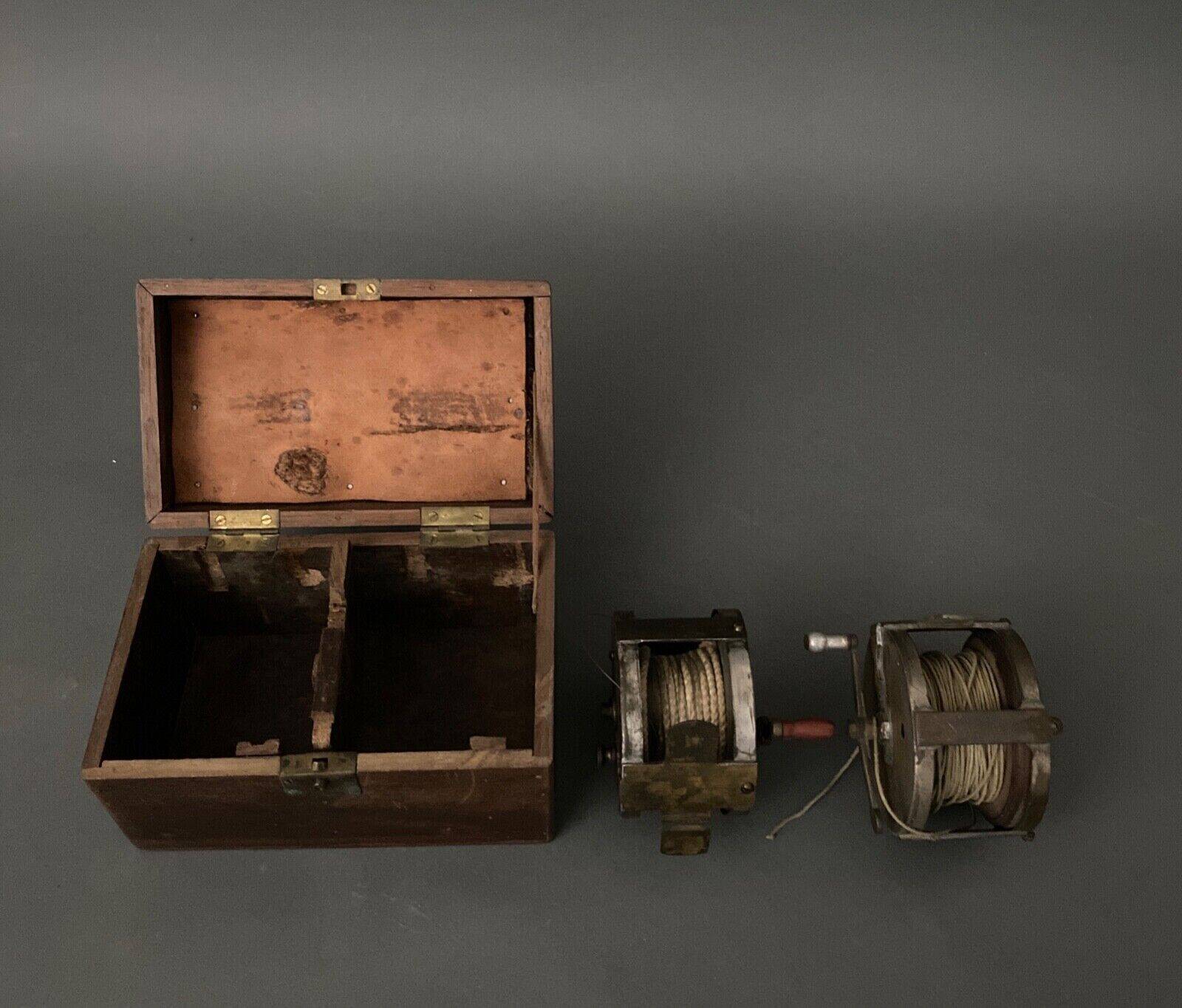 Two reel spools in their original 1900 box