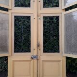 Porte d'entrée cintrée double en chêne, grilles et verre, XIXème