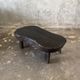 Small old Asian wooden coffee table in Japanese style, kidney-shaped top