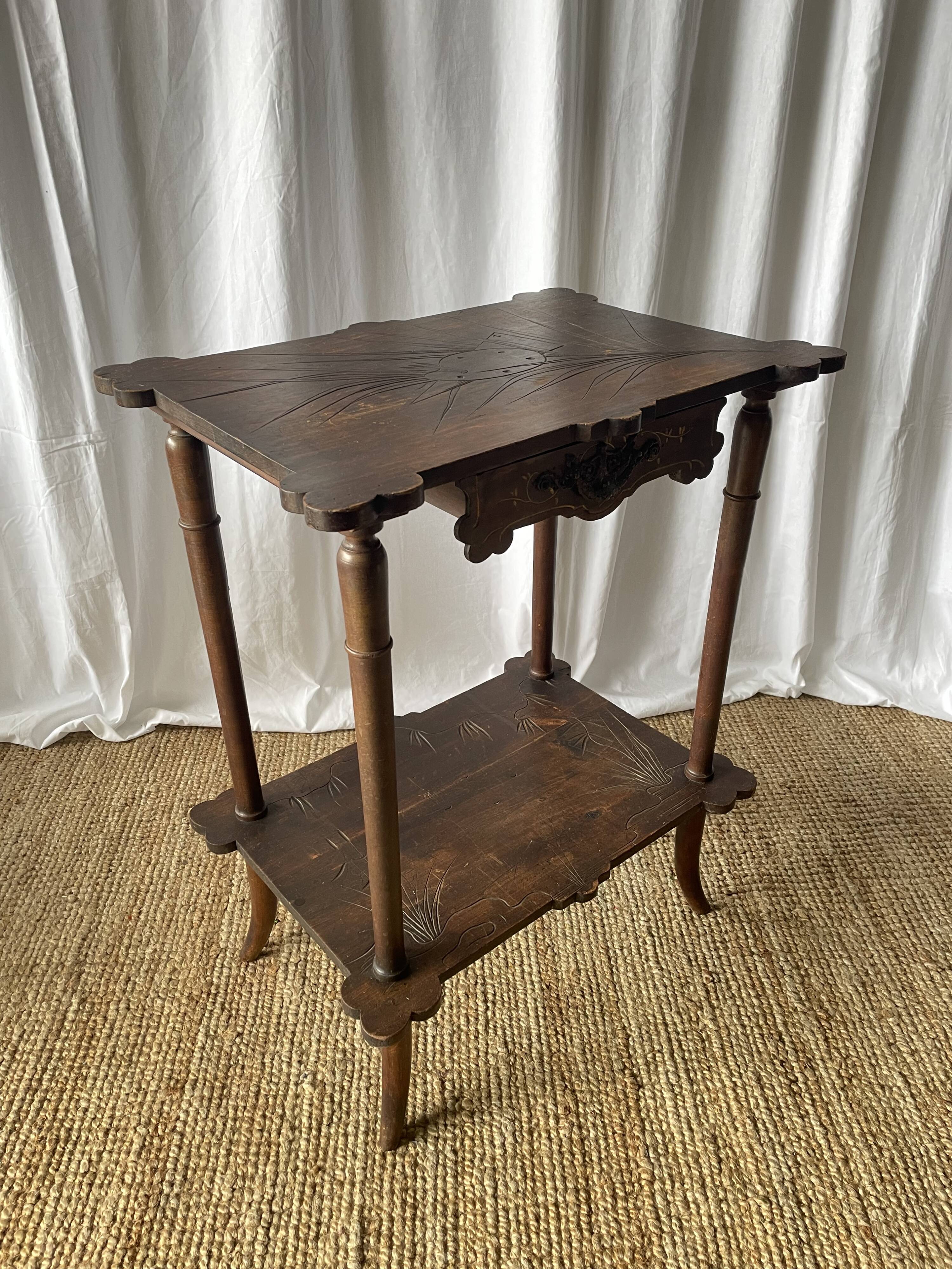 Elegant Art Nouveau side table in walnut, France early 20th century.