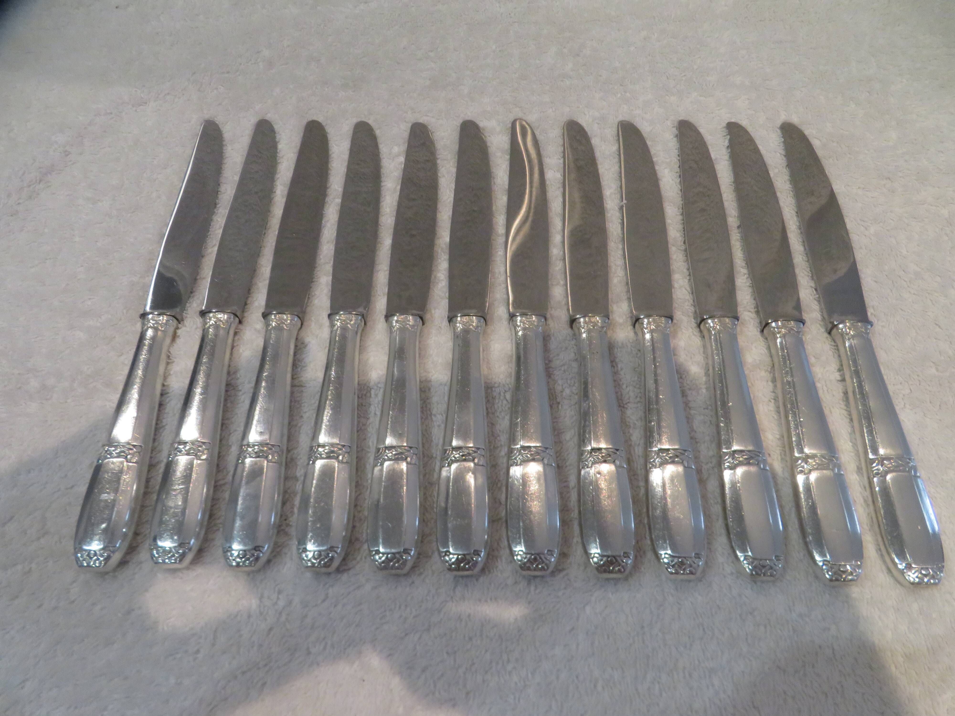 12 silver-plated dessert knives by Argit goldsmith? Art Deco floral bands