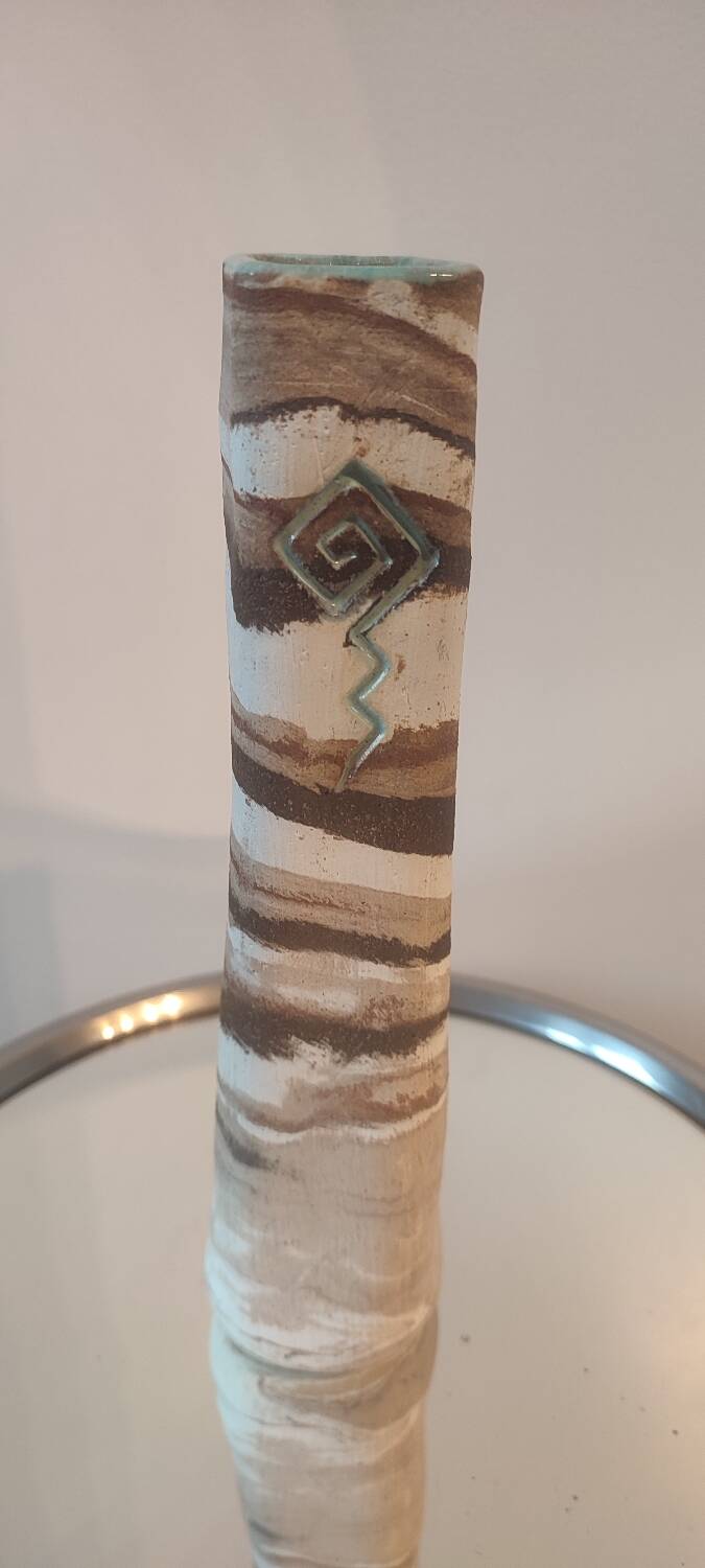 Turned stoneware vase signed with relief decoration.