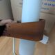 Pair of Louis Kalff NX40 teak and glass wall lights for Philips