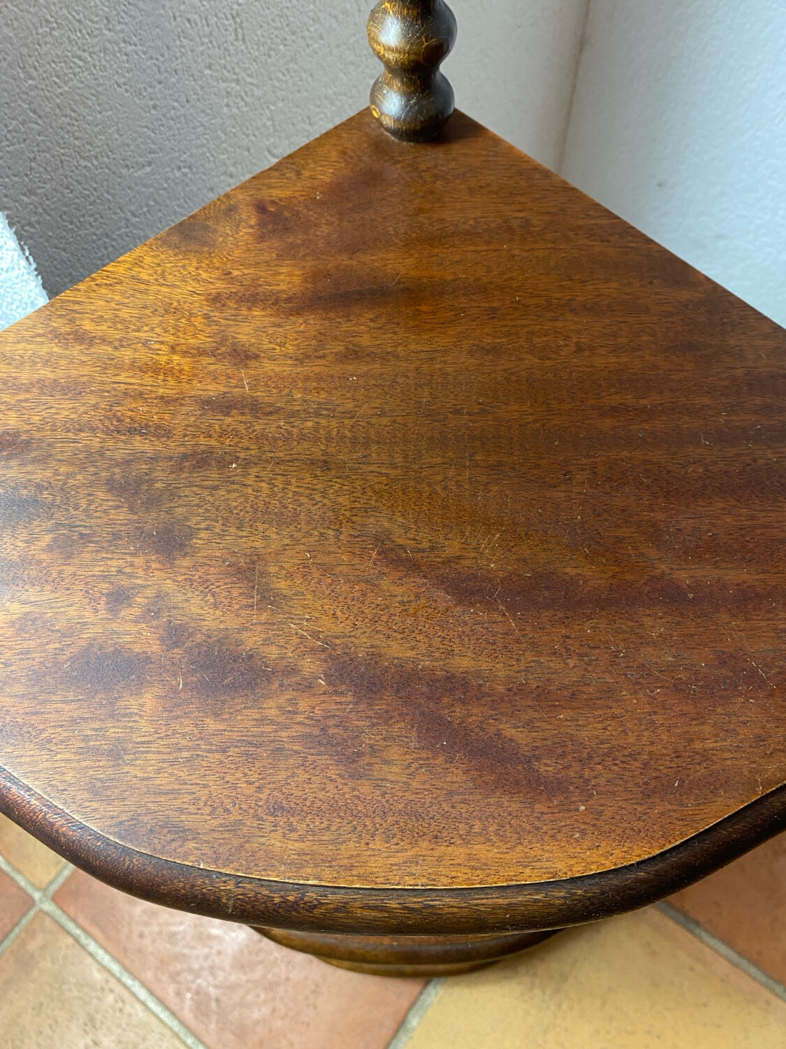 Corner shelf on a turned wooden stand